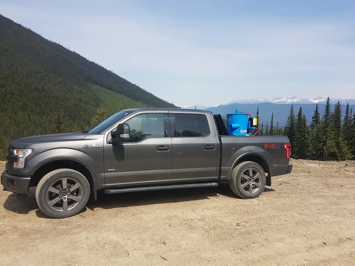 Hy-G P12 concentrator mounted in a pickup truck bed on site.